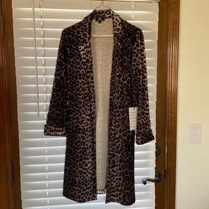 Brand new, with tags. Velvet material, cardigan. Size large.